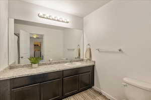 Full bath featuring vanity, washer / dryer, and a shower with curtain