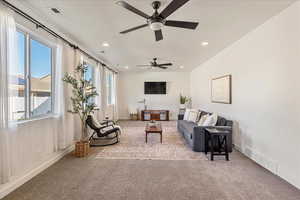 Living area with light colored carpet, recessed lighting, and ceiling fan