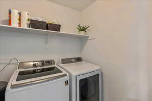 Laundry area with washer and clothes dryer