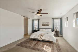 Bedroom with carpet and ceiling fan