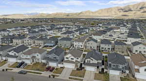 Aerial view of residential area featuring a mountainous background