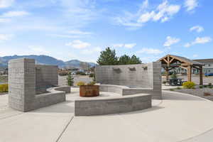 View of community with a patio and a mountain view