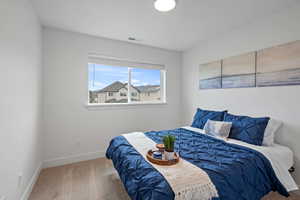 Bedroom with carpet floors and baseboards