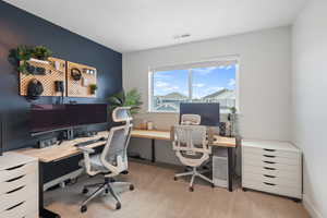 Office space featuring light carpet