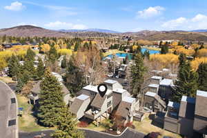 Aerial view of residential area with a water and mountain view