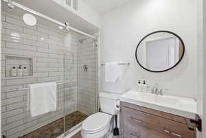 Full bath featuring vanity and a stall shower