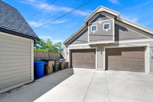View of front of home with a garage and driveway