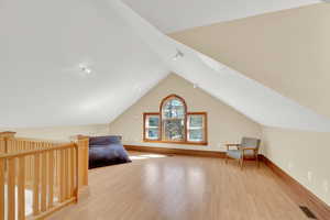 Bedroom featuring light wood-style flooring and baseboards