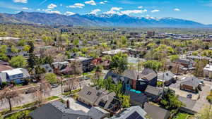 Aerial view of residential area featuring a mountainous background