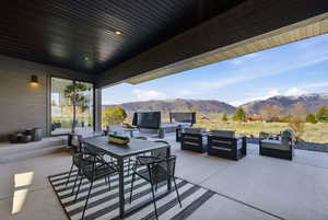 View of patio featuring a mountain view and outdoor lounge area