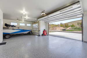 Garage featuring a garage door opener