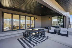 View of patio / terrace featuring an outdoor living / dining area