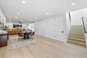 Dining area with light wood-style flooring, recessed lighting, and a ceiling fan