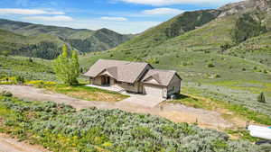 View from above of property with a mountainous background