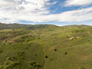 View of mountain backdrop featuring rural landscape