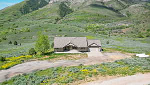 View of subject property with mountains