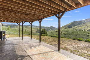 View of patio with a mountain view