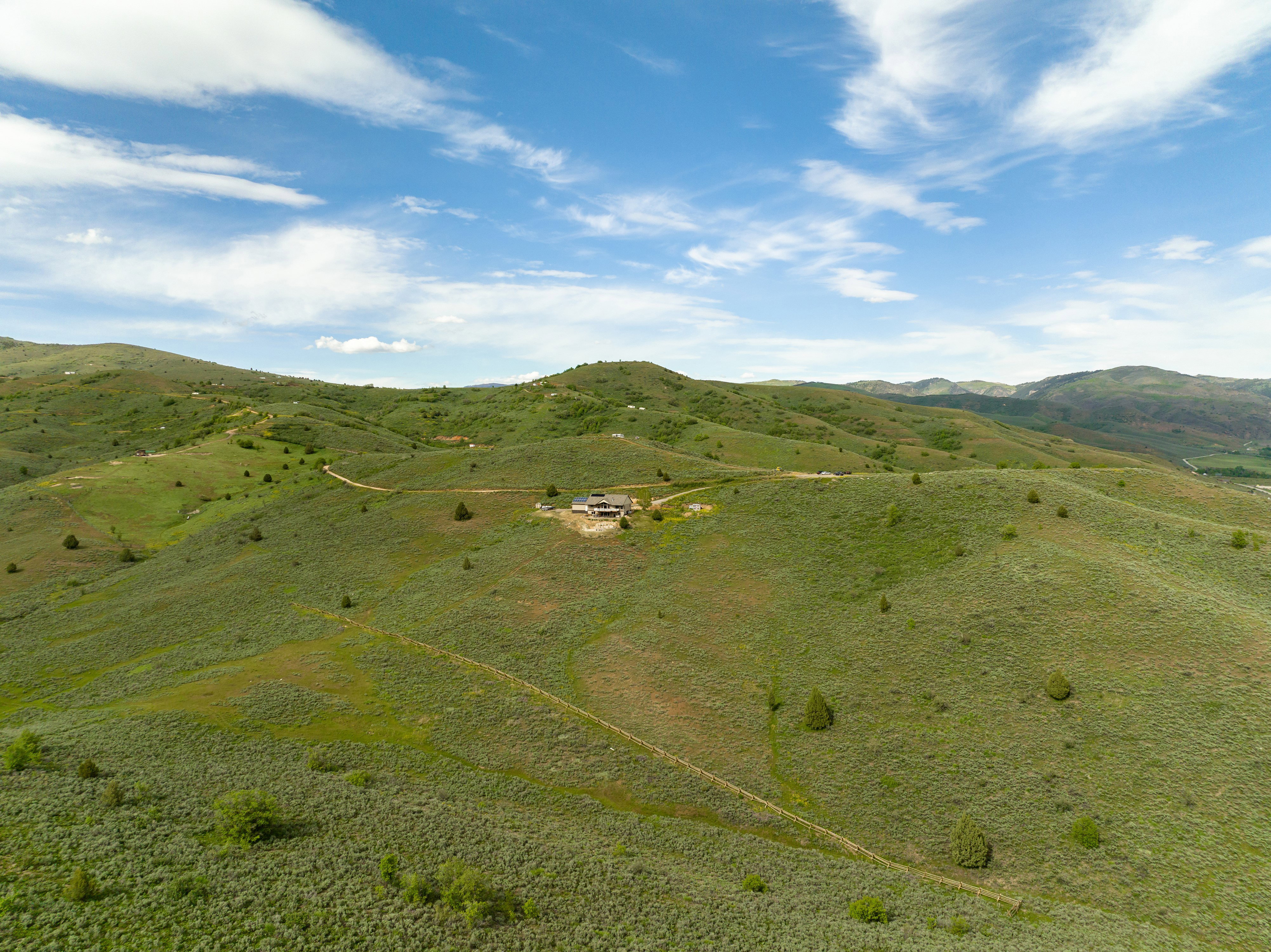 View of mountain backdrop with rural landscape