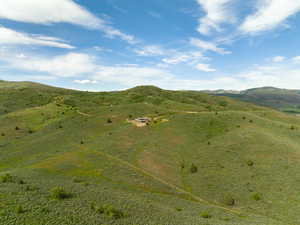 View of mountain backdrop with rural landscape