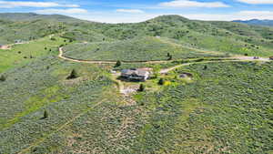 View from above of property featuring a mountainous background
