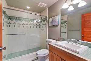 Bathroom featuring vanity and a stall shower
