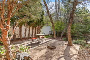 Fenced backyard with a patio area and outdoor dining area
