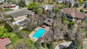 Aerial perspective of suburban area with a pool