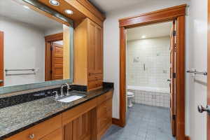 Bathroom with vanity, recessed lighting, tiled shower / bath, and light tile patterned flooring