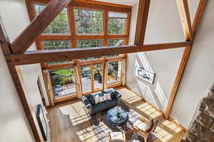 Living area with a high ceiling and wood finished floors