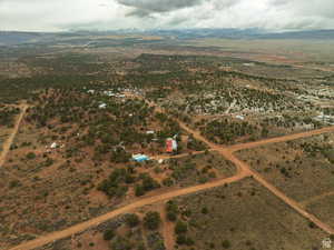 Overview of rural landscape featuring a mountain backdrop and a desert landscape