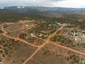 Aerial view of sparsely populated area with mountains and property boundaries highlighted