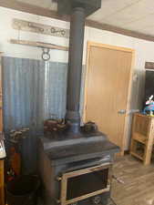 Detailed view of a wood stove and wood finished floors