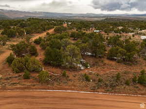 Aerial view of sparsely populated area featuring a mountainous background