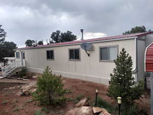 View of home's exterior featuring a metal roof