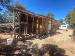 Back of property with an outbuilding and exterior structure