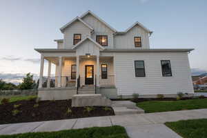 Modern farmhouse with board and batten siding and covered porch