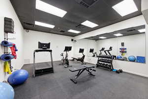 Exercise room featuring a paneled ceiling