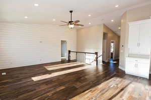 Unfurnished living room featuring vaulted ceiling, light wood-type flooring, recessed lighting, and a ceiling fan