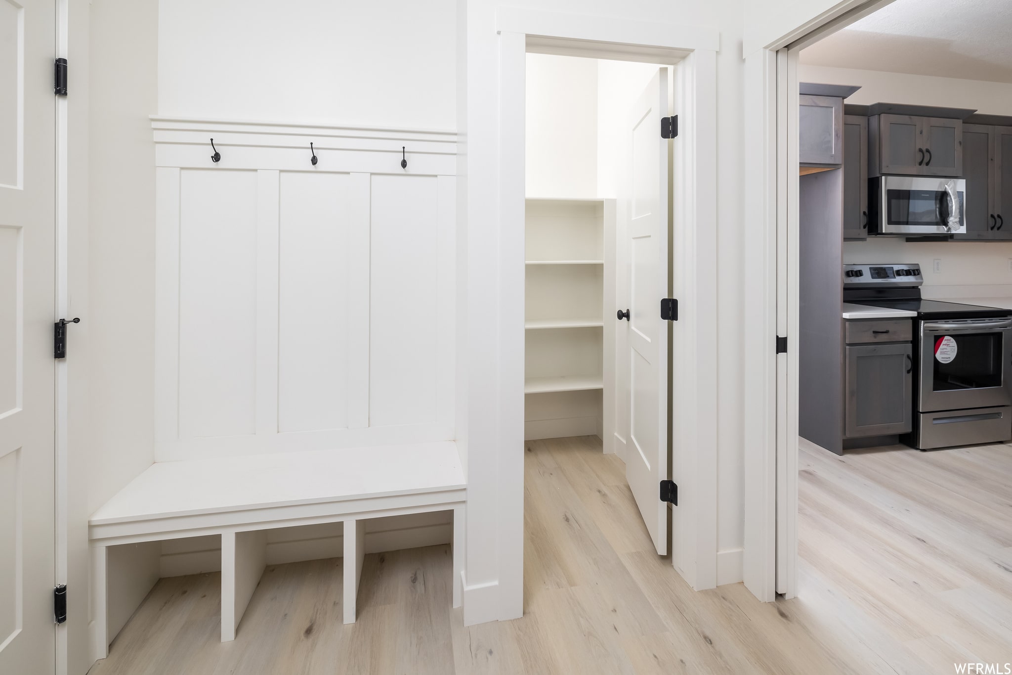 Mudroom featuring light wood-style floors