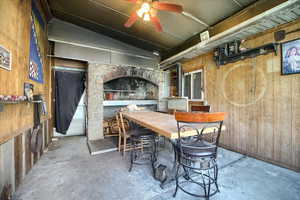 View of patio with ceiling fan and outdoor dining space