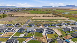 View of rural area with nearby suburban area and a mountainous background