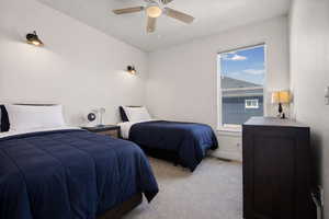 Bedroom with carpet and ceiling fan- Virtually Staged