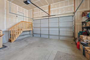Garage featuring a garage door opener