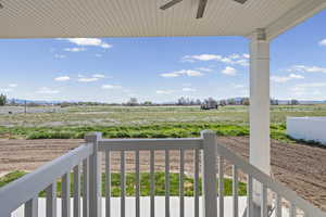 Balcony with a rural view and ceiling fan