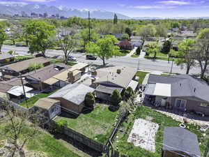 Aerial view of residential area featuring a mountain backdrop