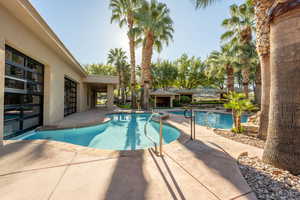 Outdoor pool featuring a patio