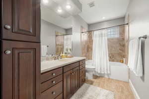 Full bath with vanity and shower / bath combo