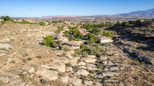 Bird's eye view of a mountain backdrop and a desert landscape