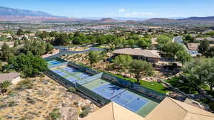 Aerial perspective of suburban area with a mountainous background