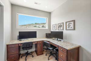 Office area featuring light carpet and recessed lighting